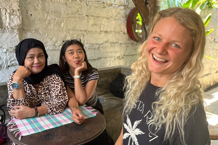 Tine laughing with Mami Lisa and Kesya after a reading